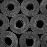 Closeup of Rolls of new black roofing felt or bitumen. Shallow depth off field