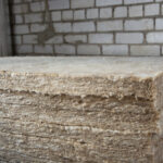 Construction insulation. Stone wool for insulating the walls of the house inside. Building construction.