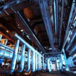 Equipment, cables and piping as found inside of a modern industrial power plant