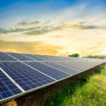 Solar panel cell on dramatic sunset sky background,clean Alternative power energy concept.