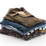 stacks of clothing on white background