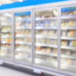 supermarket commercial refrigerators freezer showing frozen foods abstract blur background